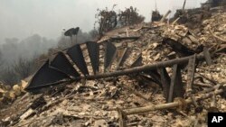 The remains of a staircase destroyed at a hilltop home is viewed in Big Sur, California, July 29, 2016. 