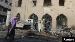 A man walks past Raqqa Museum, which activists said was damaged by airstrikes by forces loyal to Syria's President Bashar al-Assad, in Islamic State-controlled Raqqa, eastern Syria, November 25, 2014.