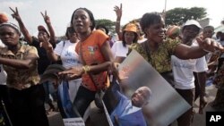 Women show support to Ivory Coast President Laurent Gbagbo during a rally called by Ivory Coast youth minister Charles Ble Goude and others in Abidjan, Ivory Coast.