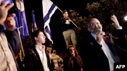 FILE - Israeli far right leader Michael Ben Ari (R) delivers a speech as his supporters gather near the Old City of Jerusalem, Nov. 6, 2014. Despite efforts to disqualify them from upcoming elections, Ari and another Jewish radical, Itamar Ben Gvir, will be able to run.