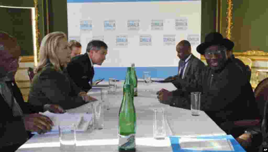 U.S. Secretary of State Hillary Rodham Clinton meets Nigeria's President Goodluck Jonathan, right, at the London Conference on Somalia, Thursday Feb. 23, 2012.