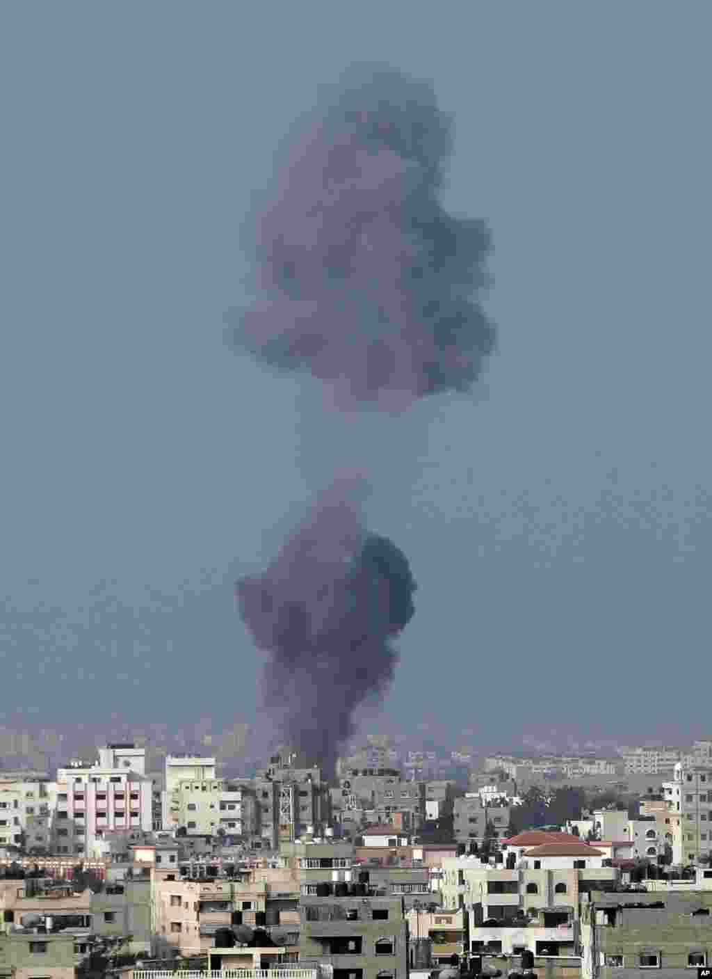 Smoke rises over Gaza City after an Israeli strike, minutes before 8 am (0500 GMT), the time agreed for a preliminary 72-hour cease-fire, on Aug. 5, 2014.&nbsp;