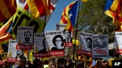 Demonstrators wave esteladas or independence flags in Barcelona, Spain, April 15, 2018, during a protest in support of Catalonian politicians who have been jailed on charges of sedition.