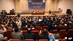FILE - Iraqi lawmakers attend the session to approve the new government in Baghdad, Iraq, September 2014.