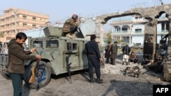 Afghan security forces inspect the site of an attack by Islamic State militants at the British charity Save the Children compound in Jalalabad on Jan. 25, 2018.