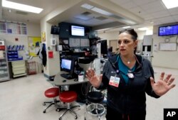 Trauma nurse Julie Anderson, talks about work Sunday night as victims of a mass shooting began to arrive, in the trauma center at the University Medical Center in Las Vegas.