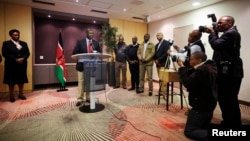 FILE - Deputy Kenyan President William Ruto addresses the media at a news conference at the Movenpick Hotel in the Hague, Oct. 15, 2013.