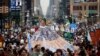 FILE - People fill the street during the People's Climate March in New York, Sept. 21, 2014.