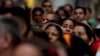 FILE - Voters wait in line to cast their ballots outside a polling station during regional elections in Caracas, Venezuela, Oct. 15, 2017. 