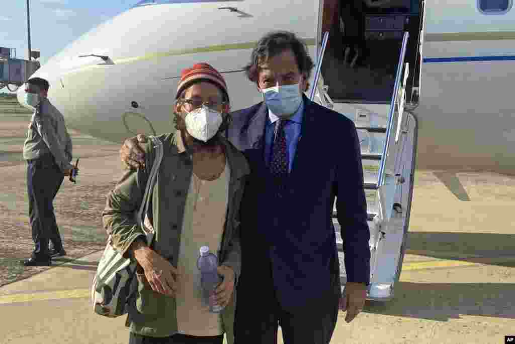 In this photo provided by the Richardson Center, former U.S. Ambassador to the U.N. Bill Richardson, right, poses with journalist Danny Fenster in Naypyitaw, Myanmar.&nbsp;Fenster, sentenced only days ago to 11 years of hard labor in the military-ruled country, was freed and on his way home Monday, Richardson said.