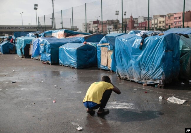 A sub-Saharan migrant washes at Ouled Ziane camp in Casablanca, Morocco, Dec. 6, 2018.