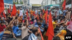 Bangladeshi garment workers and their supporters hold a rally in Dhaka, Sept. 14, 2018, to demand a higher monthly minimum wage.