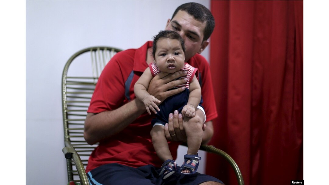 Glecion Fernando holds his 2 month old son Guilherme Soares Amorim, who was born with microcephaly, near at her house in Ipojuca, Brazil, Feb. 1, 2016.