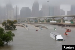 FILE - Interstate Highway 45 is submerged from the effects of Hurricane Harvey in Houston, Texas, Aug. 27, 2017.