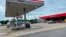 A car is parked outside the Kountry Xpress in Mulberry, Ark. Three law enforcement officers have been suspended after a video posted on social media showed a South Carolina man being held down on the ground and beaten by police.