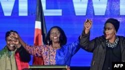 Martha Karua, running mate of Raila Odinga, dances with some of the elected, allied women candidates before giving an address to elected gubernatorial, national and county legislators at Azimio's Elected Leaders Inaugural Conference in Nairobi, Aug. 13, 2022.