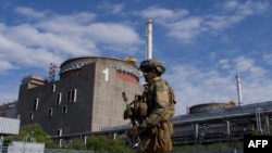 FILE - A Russian serviceman patrols the territory of the Zaporizhzhia Nuclear Power Plant, outside of Enerhodar, Ukraine, May 1, 2022.