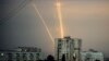 Russian rockets launched against Ukraine from Russia's Belgorod region are seen at dawn in Kharkiv, Ukraine, Aug. 15, 2022. 