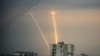 Russian rockets launch against Ukraine from Russia's Belgorod region are seen at dawn in Kharkiv, Ukraine, Aug. 15, 2022. 
