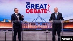 FILE - Australian incumbent Prime Minister Scott Morrison (right) and Opposition Leader Anthony Albanese debate on live television ahead of the 2022 federal election, in Sydney, Australia, May 8, 2022. 