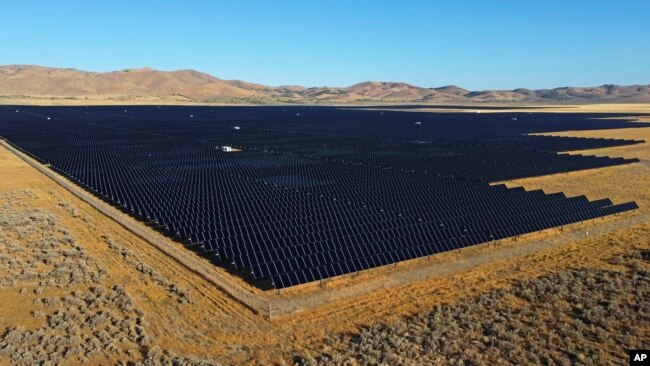 A solar farm sits Aug. 9, 2022, in Mona, Utah. The crux of the new U.S. climate change bill is to use incentives to accelerate the expansion of clean energy such as wind and solar power, speeding the transition away from the oil, coal and gas that largely