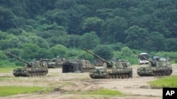 South Korean army K-9 self-propelled howitzers take positions in Paju, near the border with North Korea, South Korea, Monday, Aug. 22, 2022. (AP Photo/Ahn Young-joon)