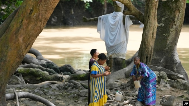 Devotees of the Osun River goddess pray in Osogbo, Nigeria, on May 29, 2022.