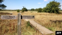 The dried out river bed is seen at the head of the River Thames, in Kemble, England, on Aug. 8, 2022.