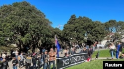 Protesters gather on the grounds of New Zealand Parliament, as they demonstrate against what they consider as government encroachment on freedoms, in Wellington, Aug. 23, 2022.