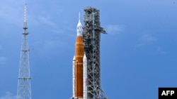 FILE - The Artemis I unmanned lunar rocket sits on the launch pad at the Kennedy Space Center in Cape Canaveral, Florida, Aug. 26, 2022.