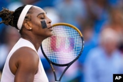 Serena Williams, of the United States, prepares to play a match against Emma Raducanu, of Britain, during the Western & Southern Open tennis tournament, in Mason, Ohio, Aug. 16, 2022.