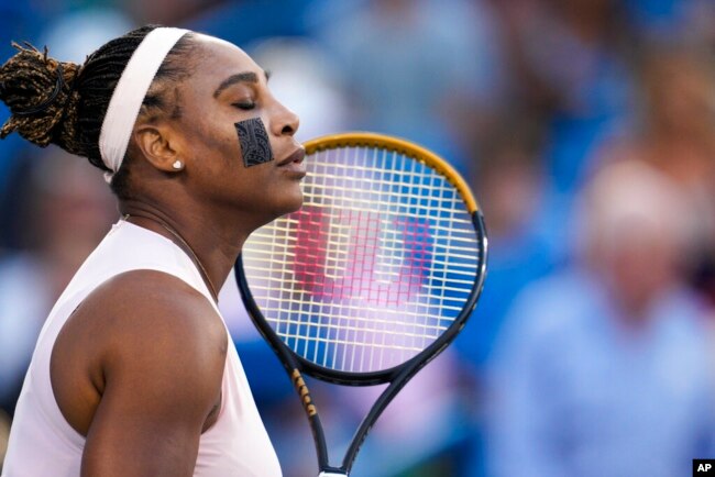 Serena Williams, of the United States, prepares to play a match against Emma Raducanu, of Britain, during the Western & Southern Open tennis tournament, in Mason, Ohio, Aug. 16, 2022.