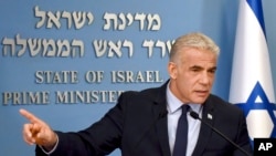 Israeli Prime Minister Yair Lapid speaks about Iran at a security briefing for the foreign press at the Prime Minister's office in Jerusalem, Aug. 24, 2022. 