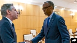 Secretary of State Antony Blinken, left, meets with Rwandan President Paul Kagame at the President's Office in Urugwiro Village in Kigali, Rwanda, Aug. 11, 2022. 