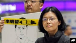 FILE - In this March 28, 2018, file photo, Lee Ching-yu, wife of Taiwanese activist Lee Ming-Che, answers questions about her husband's imprisonment in China during a press conference at Taoyuan International Airport in Taoyuan city, Taiwan.