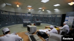 FILE - Workers are pictured inside the central control room at the Zaporizhzhia nuclear plant in Enerhodar, Ukraine, April 9, 2013.