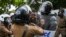 FILE - University students clash with police during a demonstration in Colombo, Sri Lanka.