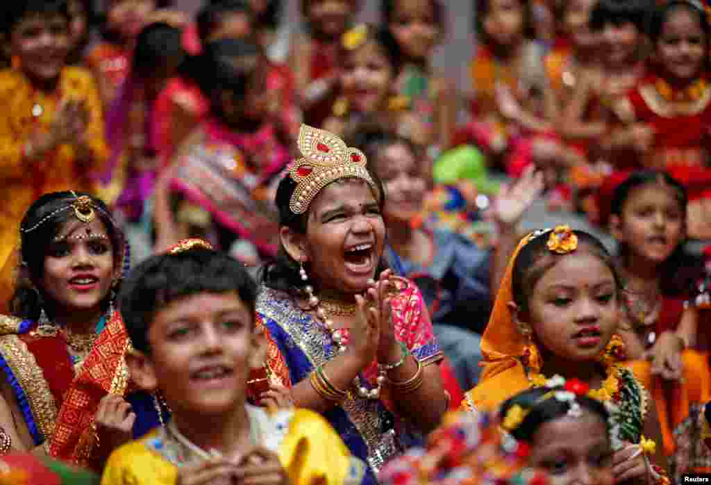 Children celebrate the Janmashtami festival, marking the birth anniversary of Hindu Lord Krishna, at a school in Ahmedabad, India. (REUTERS/Amit Dave )