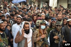 FILE - Demonstrators take part in a protest against Pakistani airstrikes, in Khost, Afghanistan, April 16, 2022.