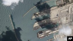 El buque de carga Razoni, con granos provenientes de Ucrania, en el puerto de Tartus en Siria. Foto satelital cortesía de Planet Labs PBC, tomada el 15 de agosto de 2022. (Planet Labs PBC vía AP)