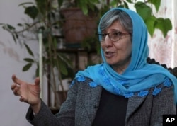 FILE - Sima Samar, a prominent activist and physician, who has been fighting for women's rights in Afghanistan for the past 40 years, gives an interview to The Associated Press, at her house in Kabul, Afghanistan, March 6, 2021, ahead of the Taliban takeover of the country.