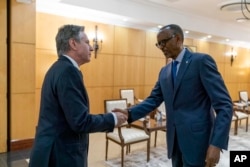 FILE - Secretary of State Antony Blinken, left, meets with Rwandan President Paul Kagame at the President's Office in Urugwiro Village in Kigali, Rwanda, Aug. 11, 2022.