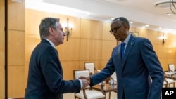 Secretary of State Antony Blinken, left, meets with Rwandan President Paul Kagame at the President's Office in Urugwiro Village in Kigali, Rwanda, Aug. 11, 2022. 