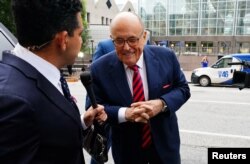 Rudy Giuliani, former U.S. President Donald Trump's personal lawyer, arrives at a courthouse to face a special grand jury regarding a probe into the 2020 election in Atlanta, Georgia, August 17, 2022.