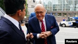 FILE - Rudy Giuliani, former U.S. President Donald Trump's personal lawyer, arrives at a courthouse to face a special grand jury regarding a probe into the 2020 election in Atlanta, Aug. 17, 2022.