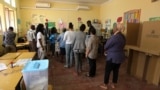 FILE - Voters queue to cast their votes at a polling station in general elections in Luanda, Angola, Aug. 23, 2017. 