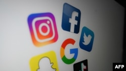 File: the logo of the multinational American Internet technology and services company, Google (center), the American online social media and social networking service, clockwise: Facebook (Top), Twitter, Tik Tok, Snapchat, and Instragram (top L). Taken 10.21.2020