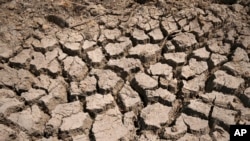 FILE - Cracked dry mud illustrates the climate-change induced drought that has hit northeast Africa for the fifth year in a row. Taken 8.20.2022