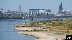 The river Rhine is pictured with low water in Cologne, Germany, Aug. 10, 2022. The low water levels are threatening Germany's industry as more and more ships are unable to traverse the key waterway.