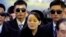 FILE - In this Feb. 9, 2018, photo, North Korean leader Kim Jong Un's younger sister Kim Yo Jong, center, arrives at the Jinbu train station in Pyeongchang, South Korea. 